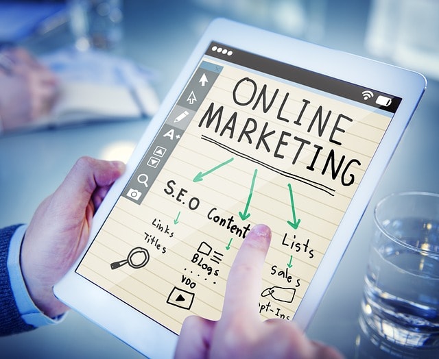 A tablet showing a online marketing cartoon. 